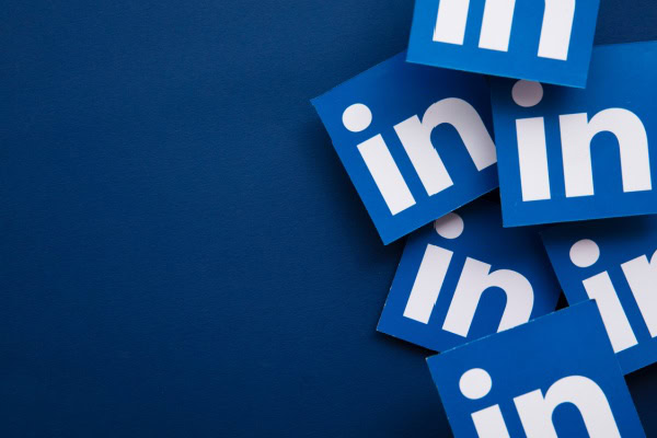 blue background with arranged LinkedIn logos on the right side