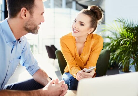 coach and client conversing while both seated