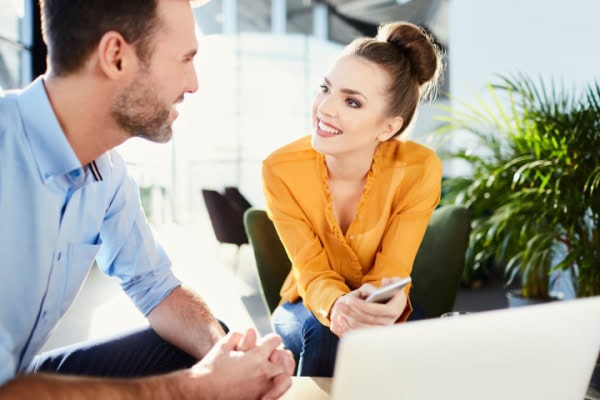 coach and client conversing while both seated