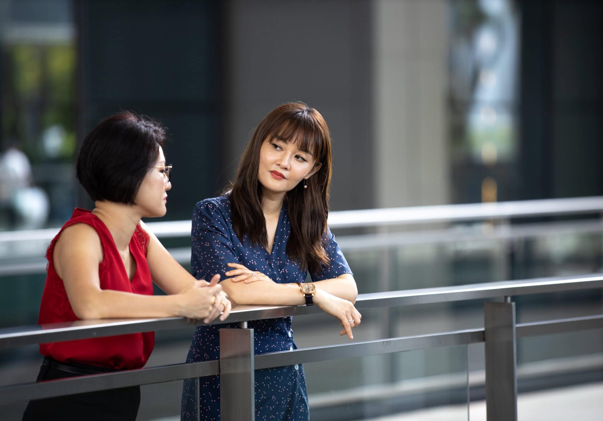 Two women engaged in a meaningful conversation during a coaching session, highlighting empathy and human connection in coaching.