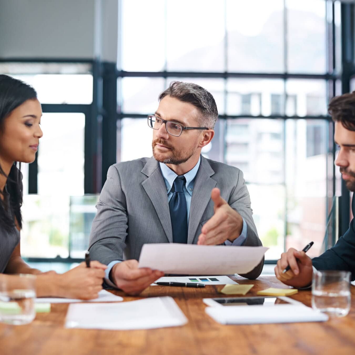 A group of professionals go through the ACTC structure in an office setting