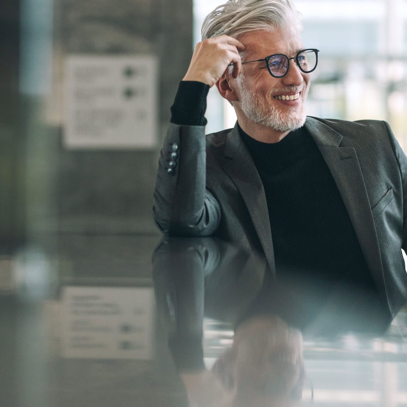 An older professional man advanced to his ICF Master Certified Coach (MCC) credential