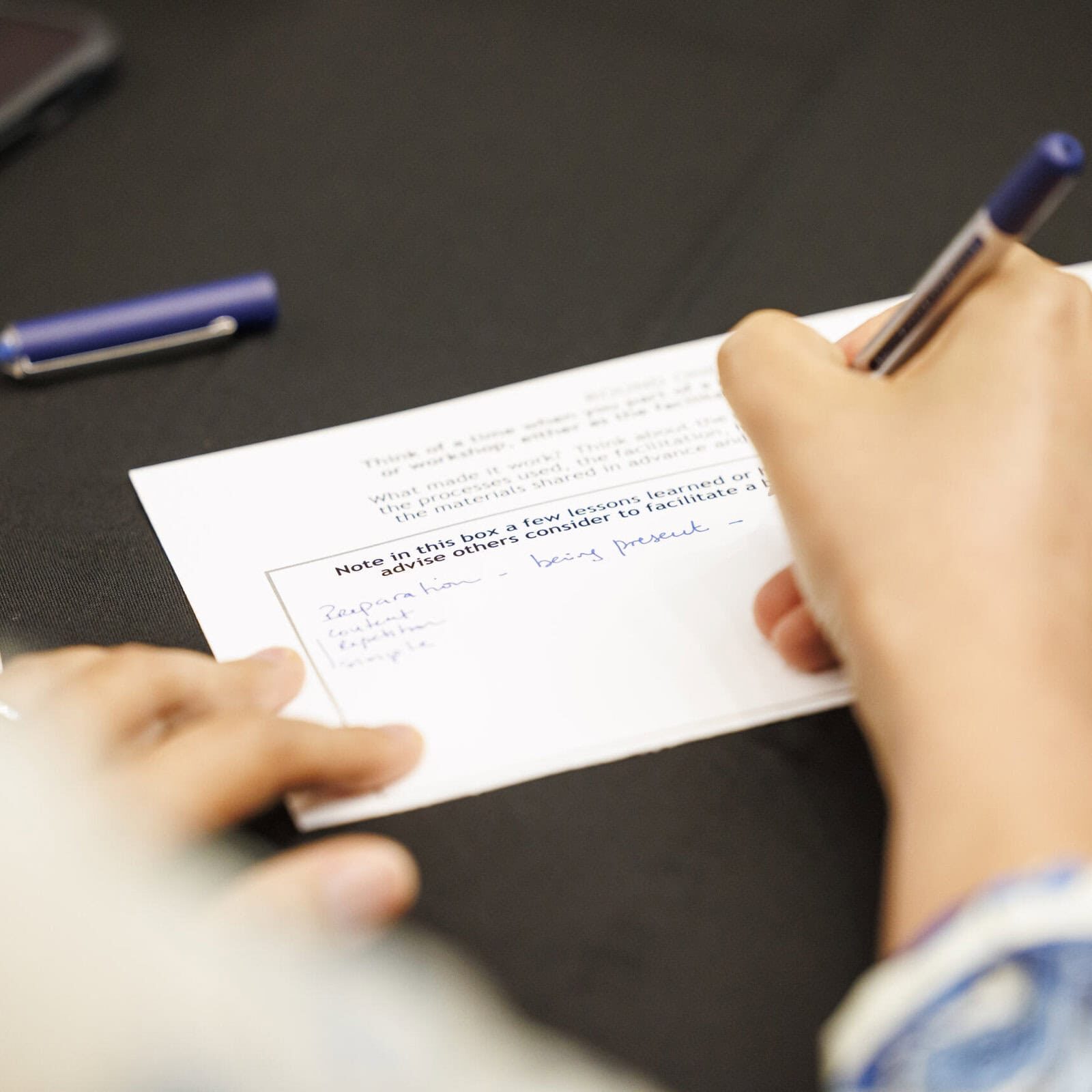 Participants in an ICF Coaching Lab engaging in interactive coaching exercises to develop new skills