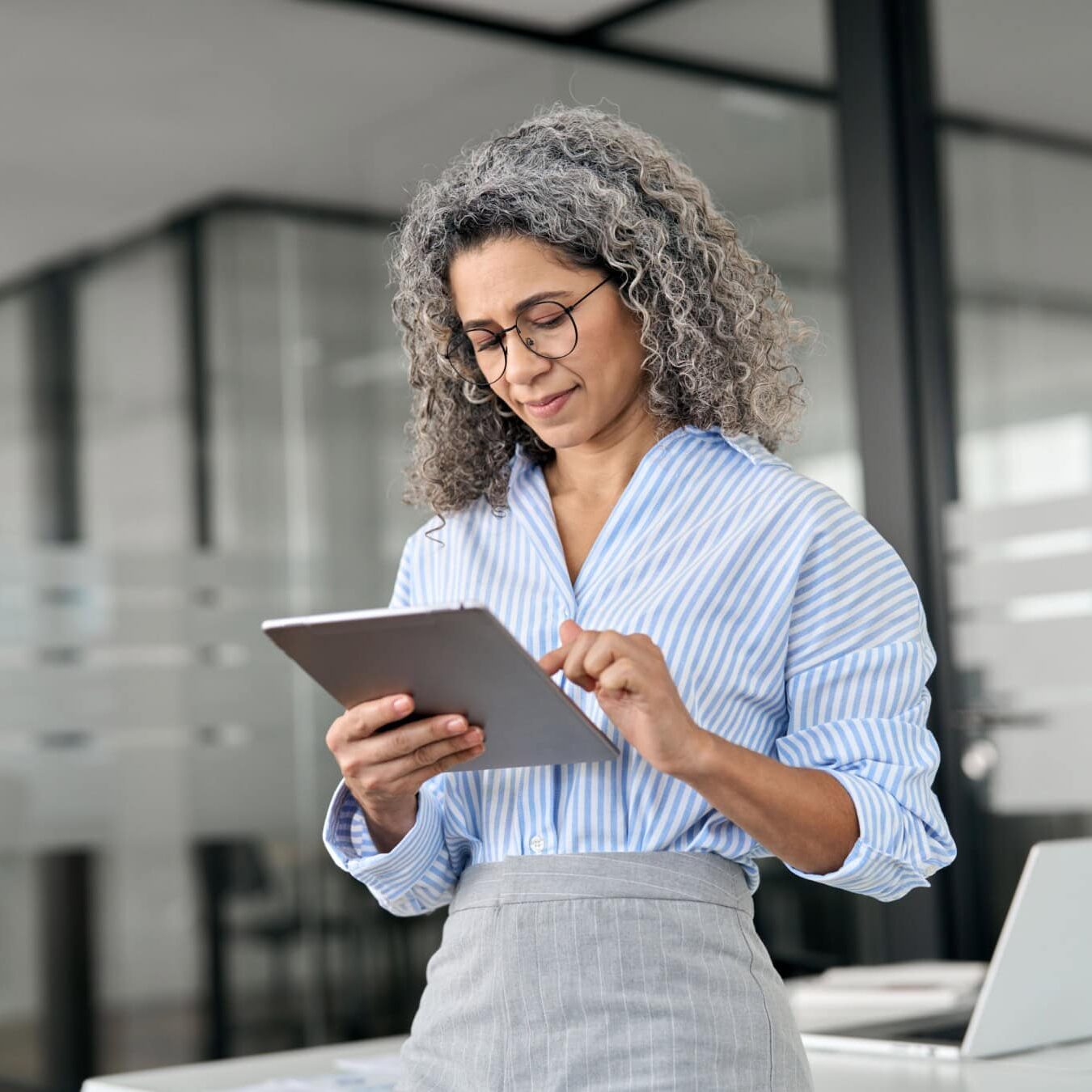 Coaching educator using an iPad for virtual coaching instruction.