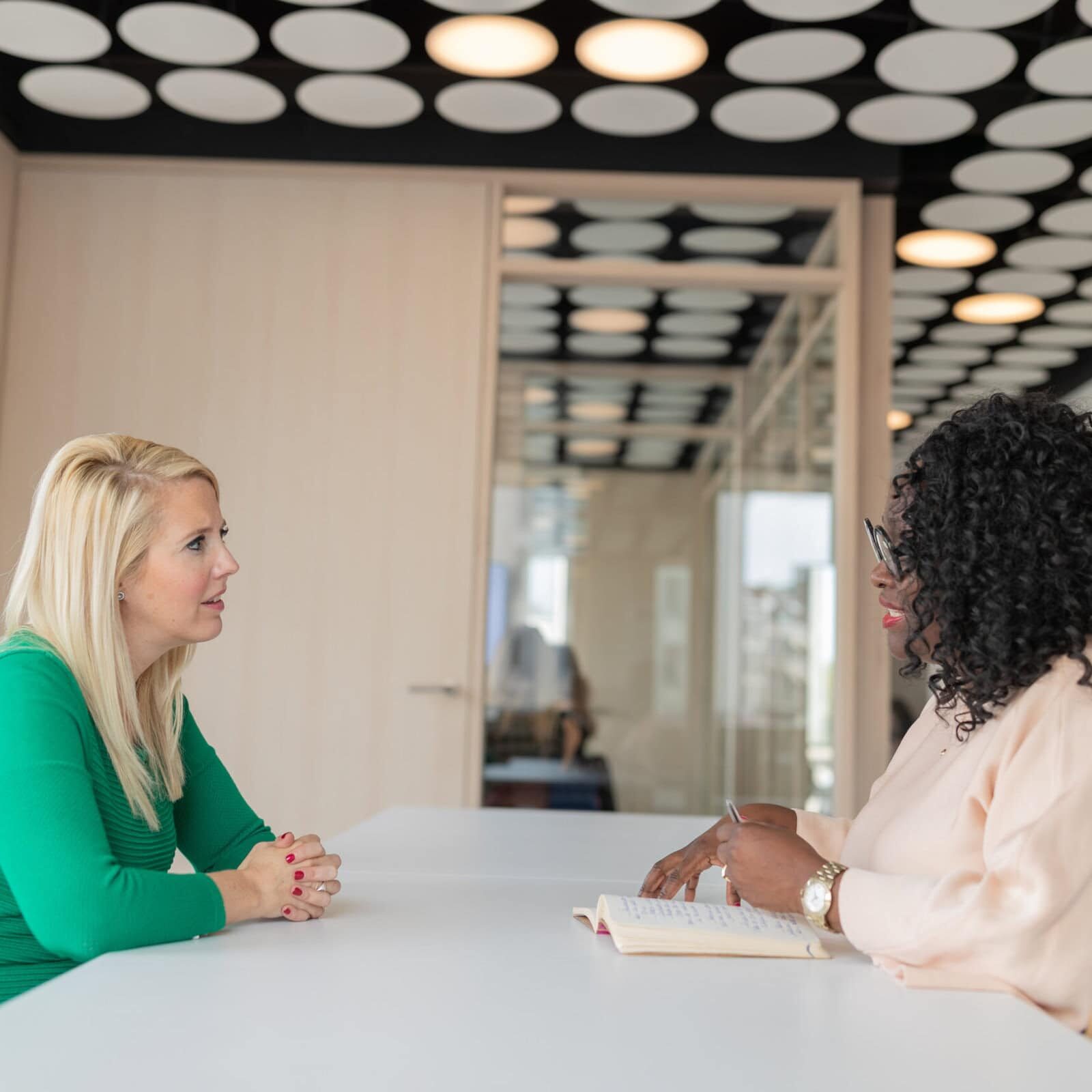 Coach helping a client unlock their true potential and overcome obstacles."