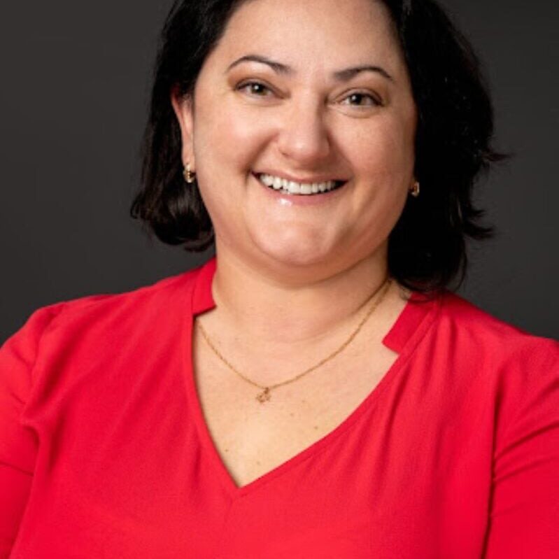 Jenny Barkan ACC headshot photo, smiling woman with dark hair