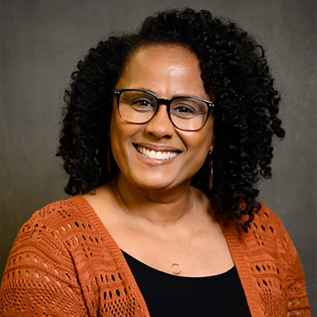 Headshot of Angela Carter, a consultant with the International Coaching Federation. Known for her work in diversity, equity, inclusion, and belonging (DEIB).  
