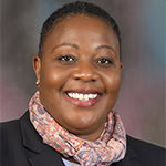 Headshot of Tamala Chirwa, PCC with the International Coaching Federation. Known for coaching C-suite leaders to enhance leadership and team performance.