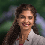 Headshot of Pooja Khandelwal, ACTC and MCC with the International Coaching Federation. Known for transforming career transitions and fostering coaching cultures.