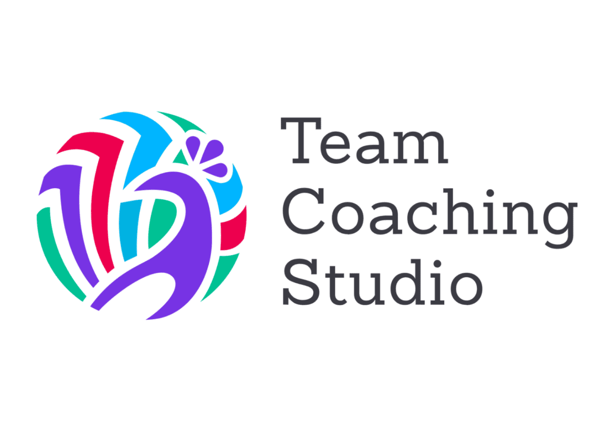 Team Coaching Studio logo featuring a colorful abstract peacock design next to the company name in bold, dark gray text.